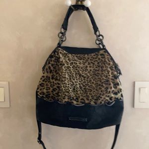 Used once. BCBG Leopard fabric black trim bag
